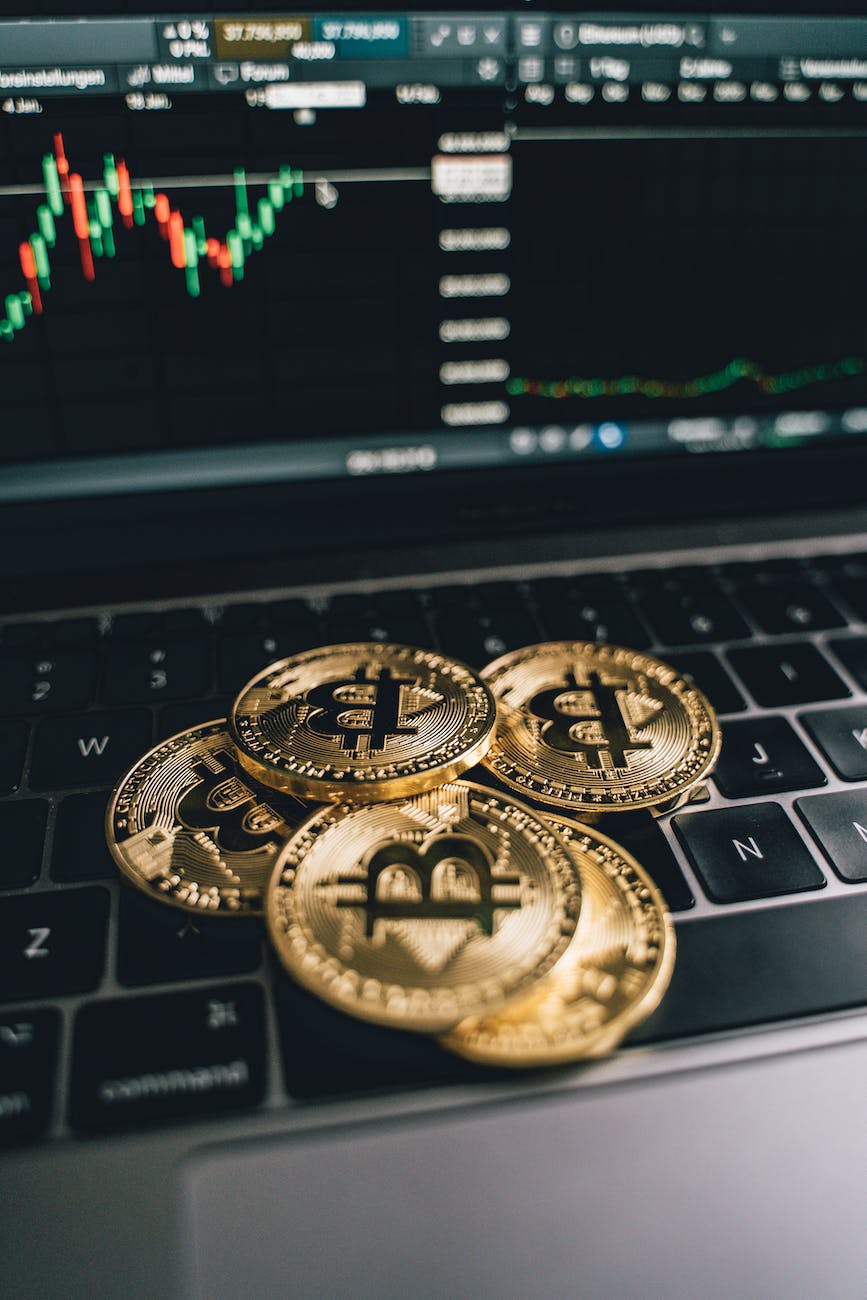 pieces of bitcoins on laptop keyboard